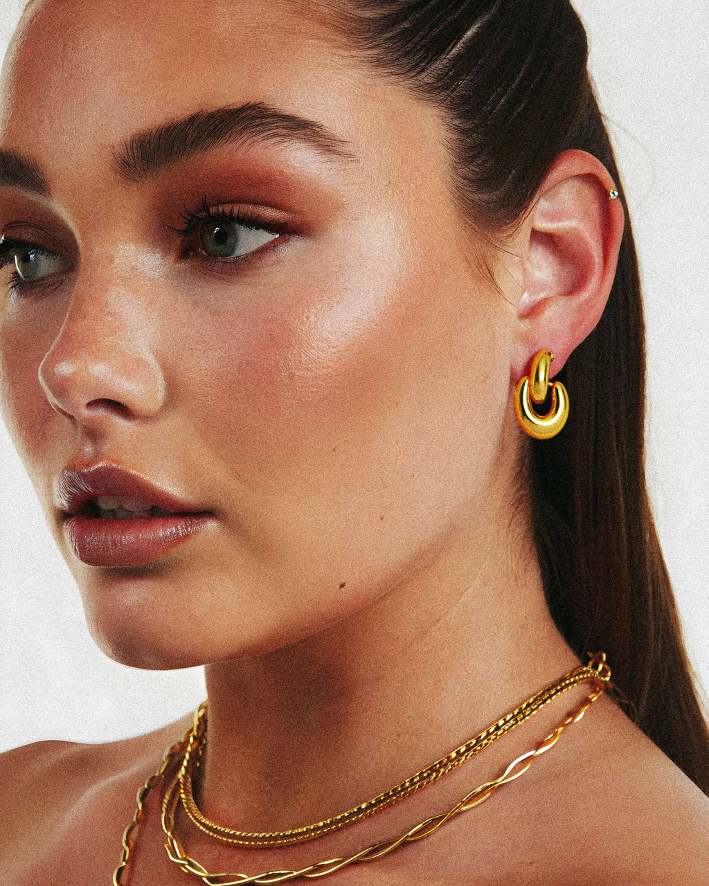 Sparkle Huggie Earrings worn – 18K gold waterproof by BILARRI